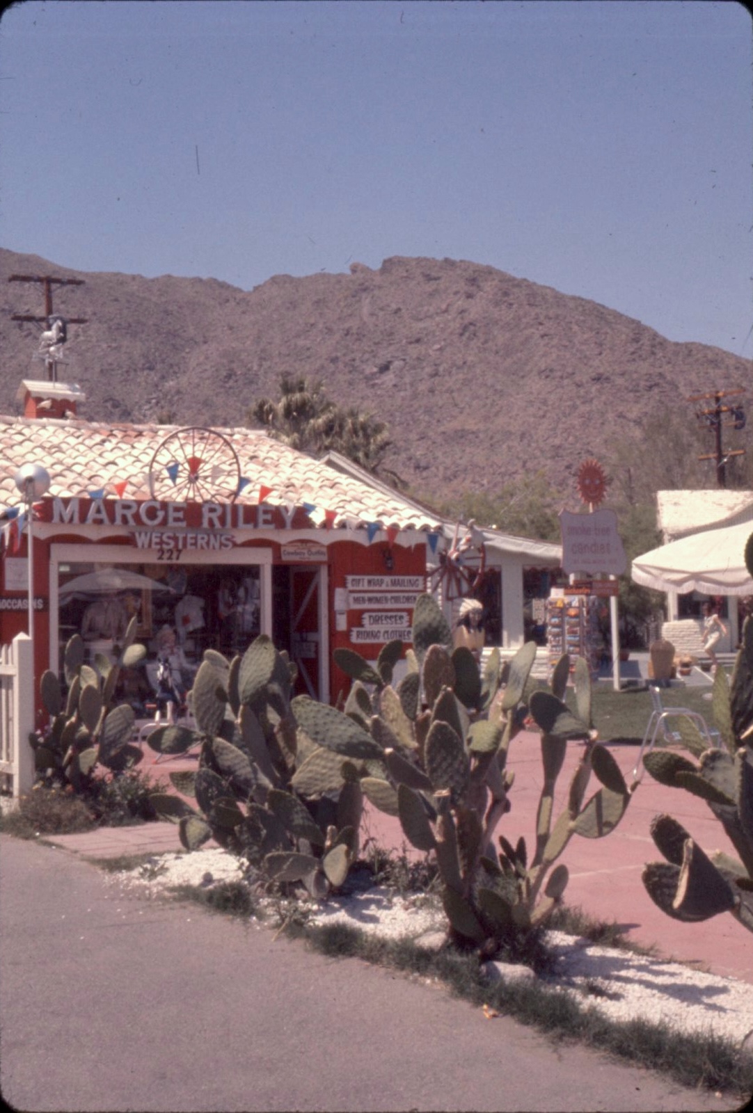 A storefront image presented by Deserted Films with 'MARGE RILEY WESTERNS' signage.