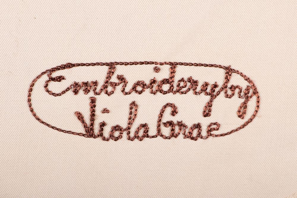 'Embroidered by Viola Grae' worked into an auction-presented ensemble.